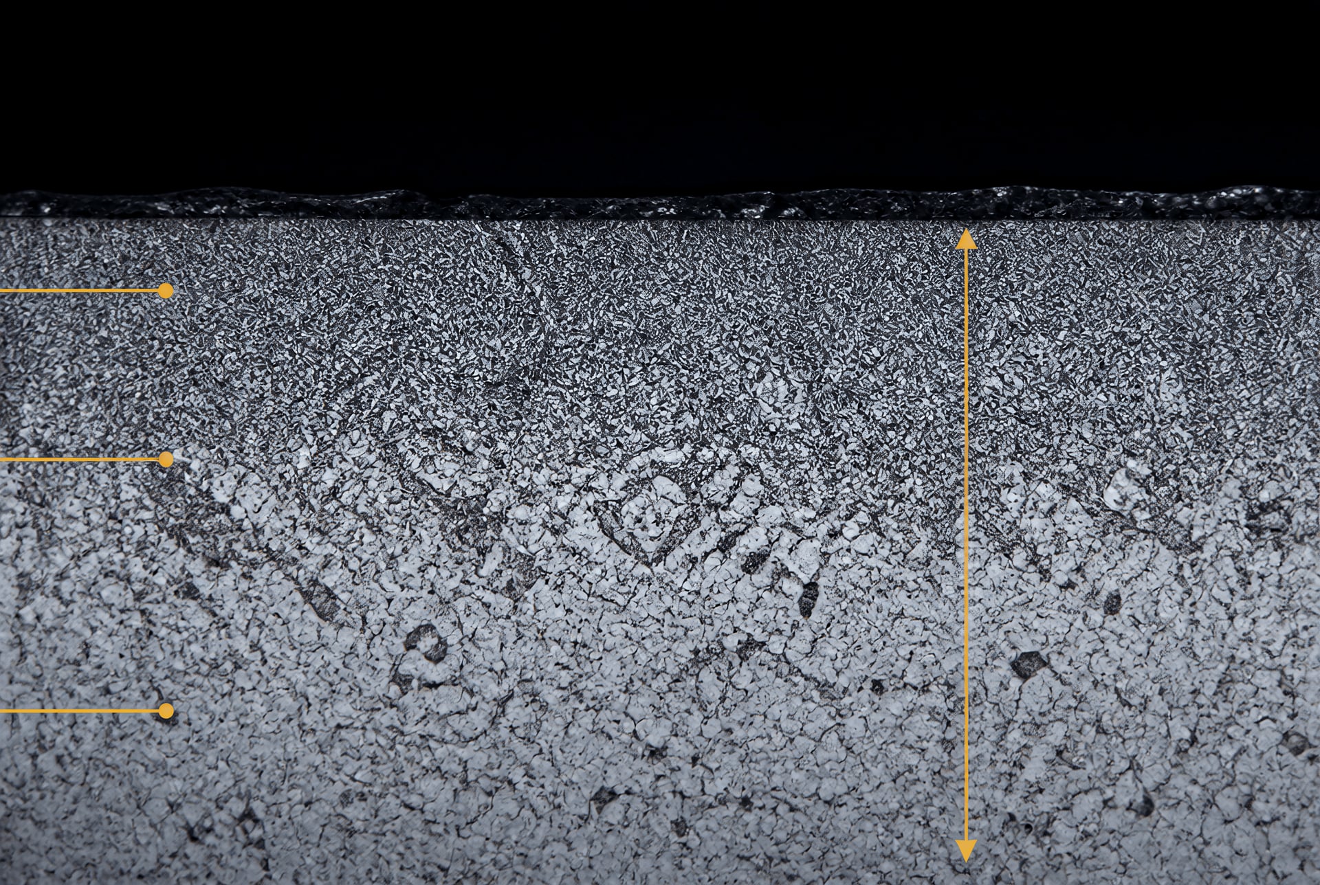 Metallographic cross-section showing a hardened steel case and transition to the core
