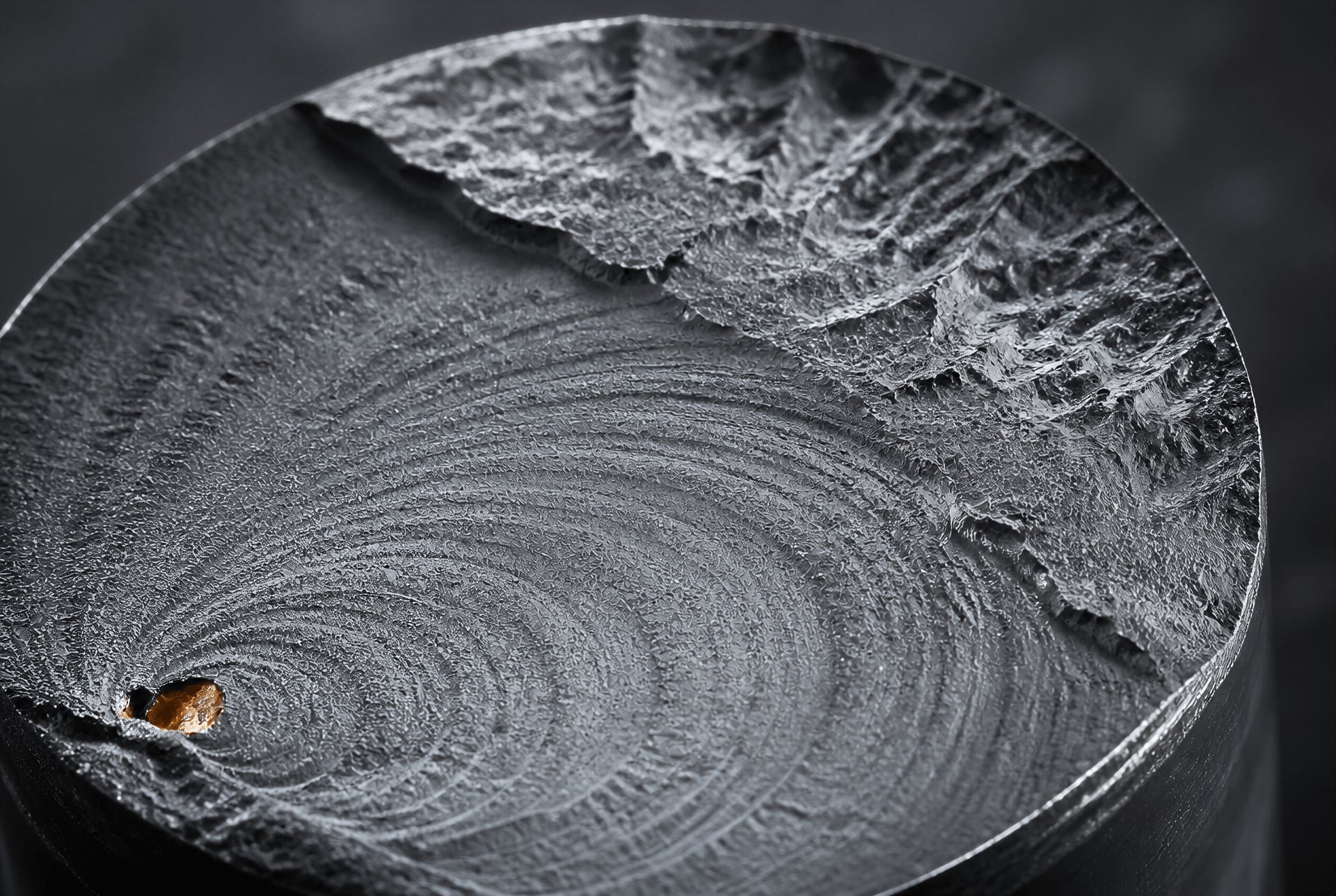 Steel fatigue fracture surface with beach marks and final overload zone