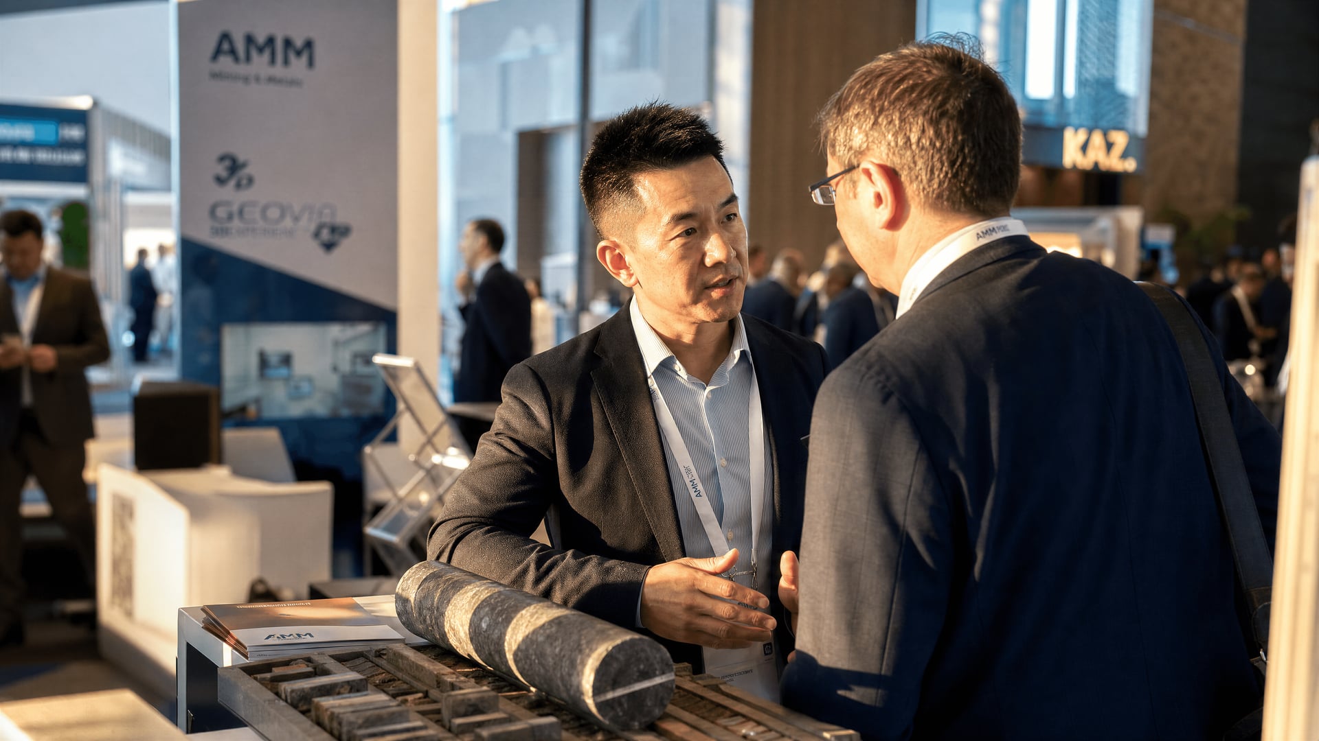 Delegates reviewing mining technology exhibition stands inside Hilton Astana during AMM 2026