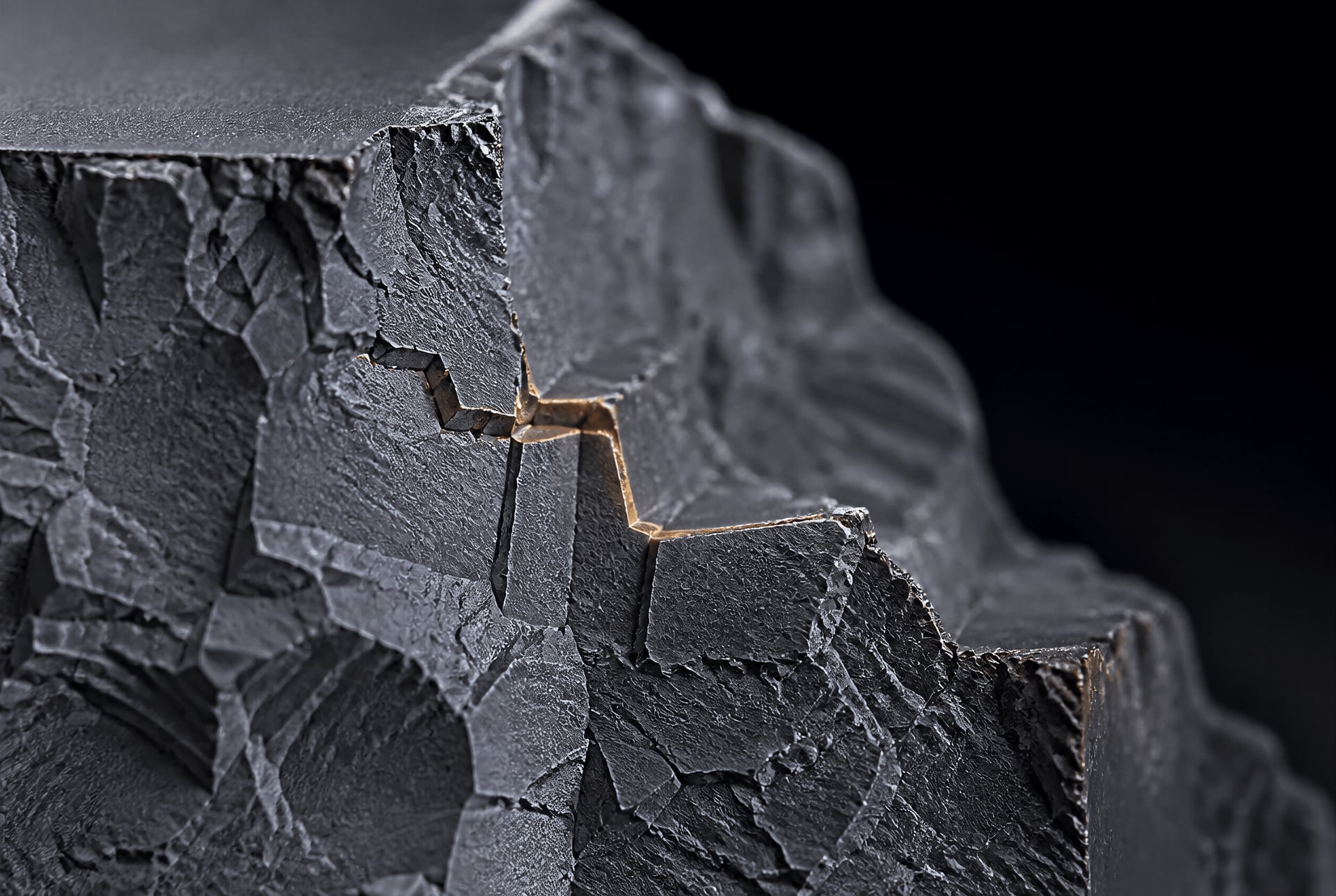 Cleavage fracture surface with crack paths deflected across fine ferrite grains.